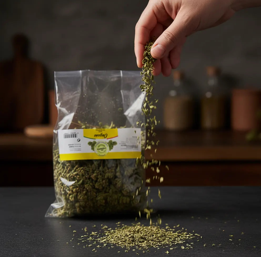 Hand pouring dried herbs from a transparent bag with a label on a dark surface.